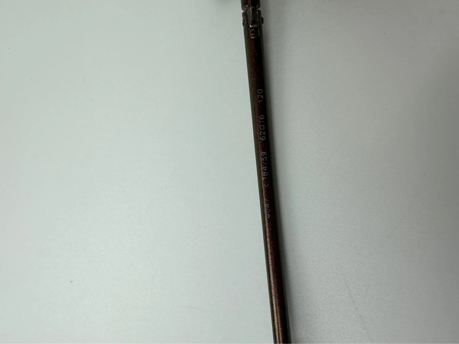 Chanel brown and orange rimless sunglasses with double CC logo detail.
