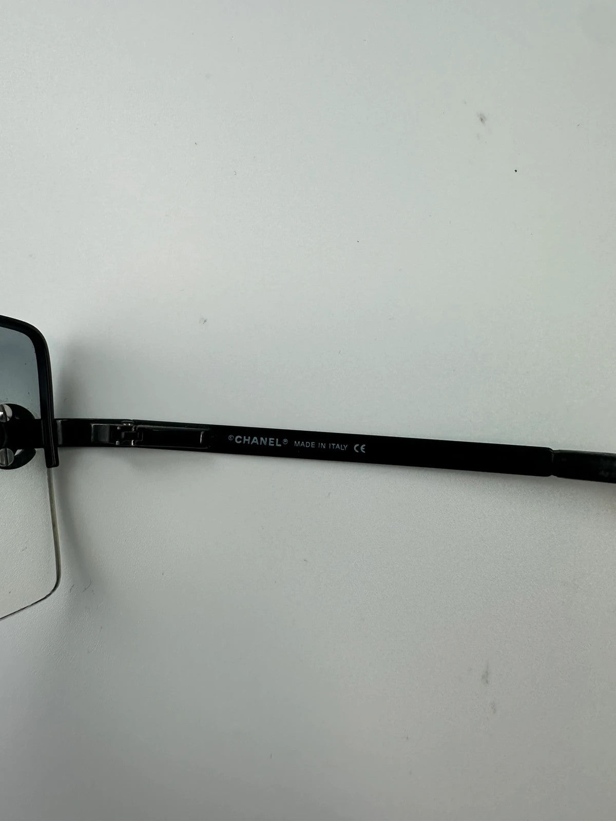Chanel black and blue rimless sunglasses with double CC logo and strass details.