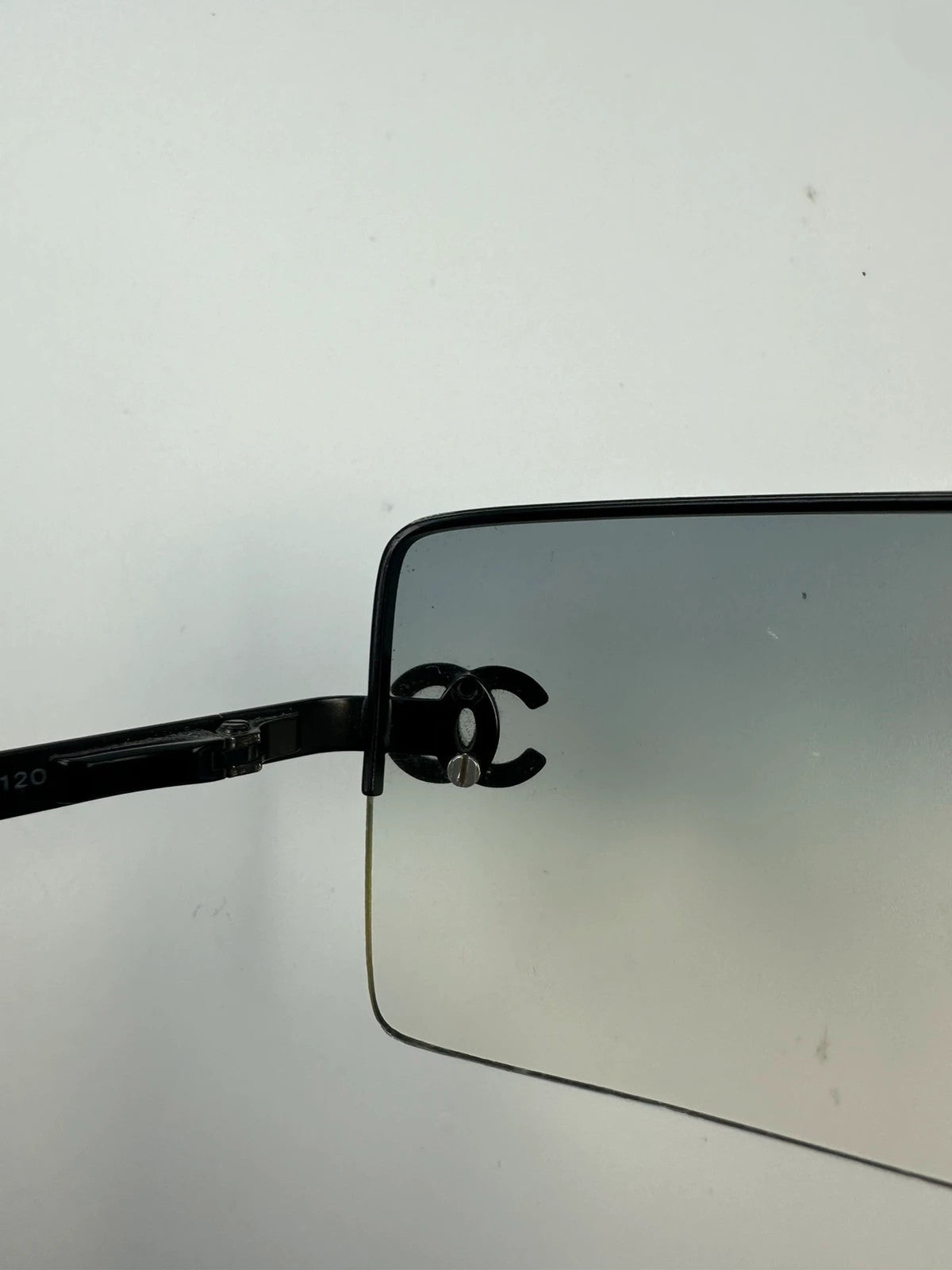 Chanel black and blue rimless sunglasses with double CC logo and strass details.