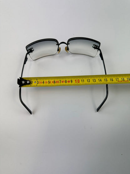 Chanel black and blue rimless sunglasses with double CC logo and strass details.