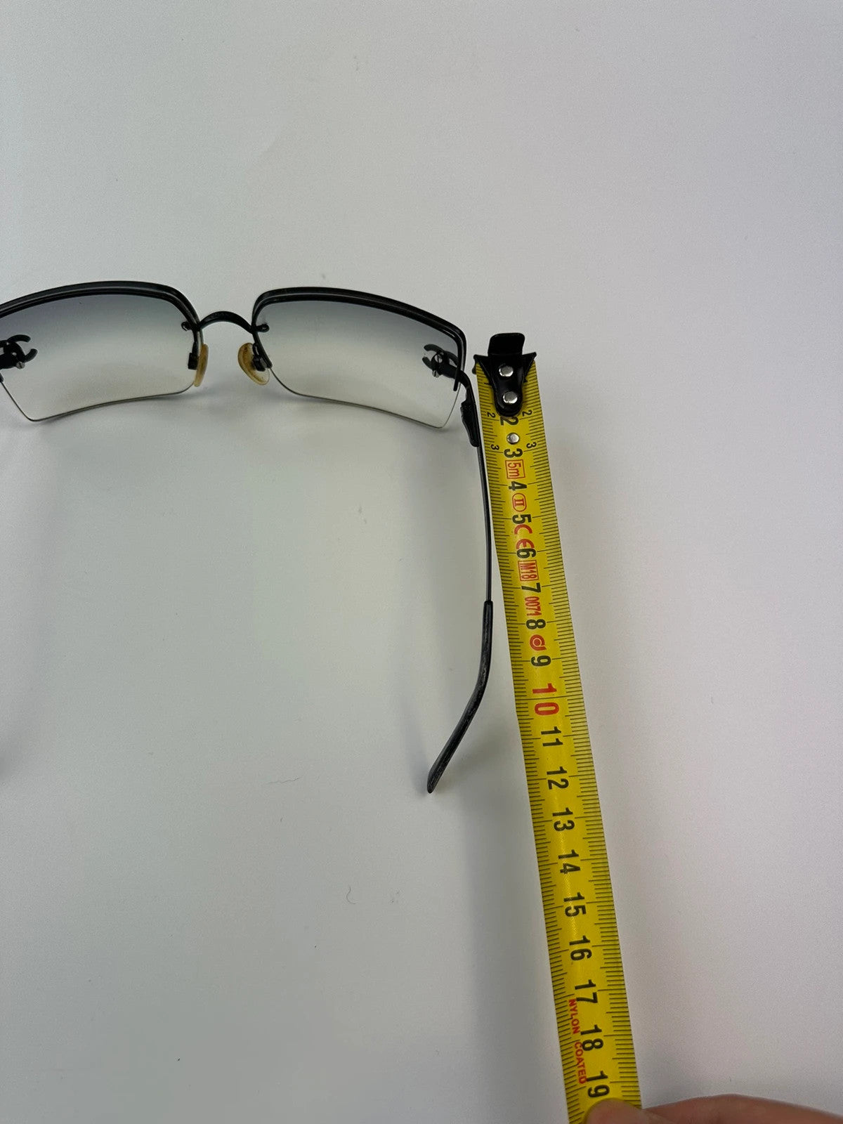 Chanel black and blue rimless sunglasses with double CC logo and strass details.