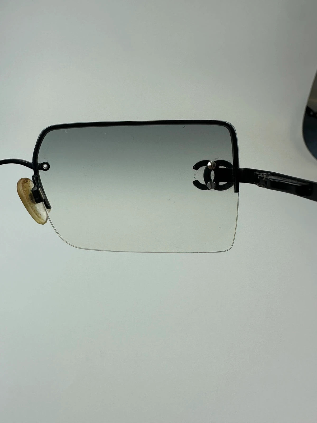 Chanel black and blue rimless sunglasses with double CC logo and strass details.
