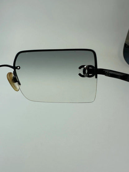 Chanel black and blue rimless sunglasses with double CC logo and strass details.