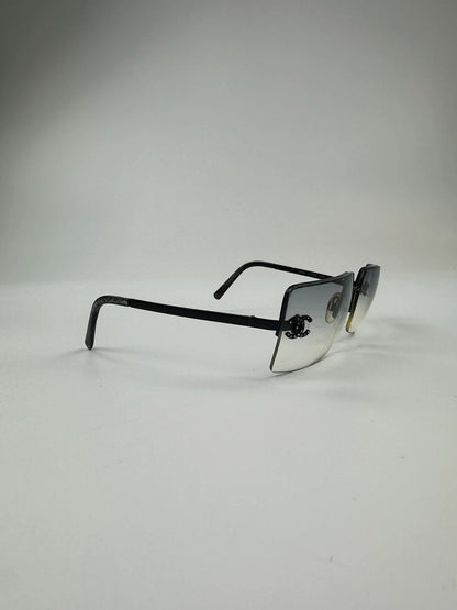 Chanel black and blue rimless sunglasses with double CC logo and strass details.