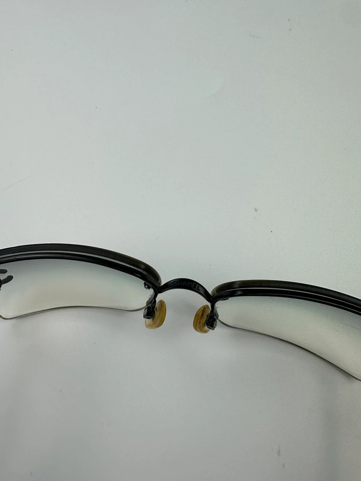 Chanel black and blue rimless sunglasses with double CC logo and strass details.