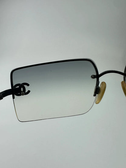 Chanel black and blue rimless sunglasses with double CC logo and strass details.
