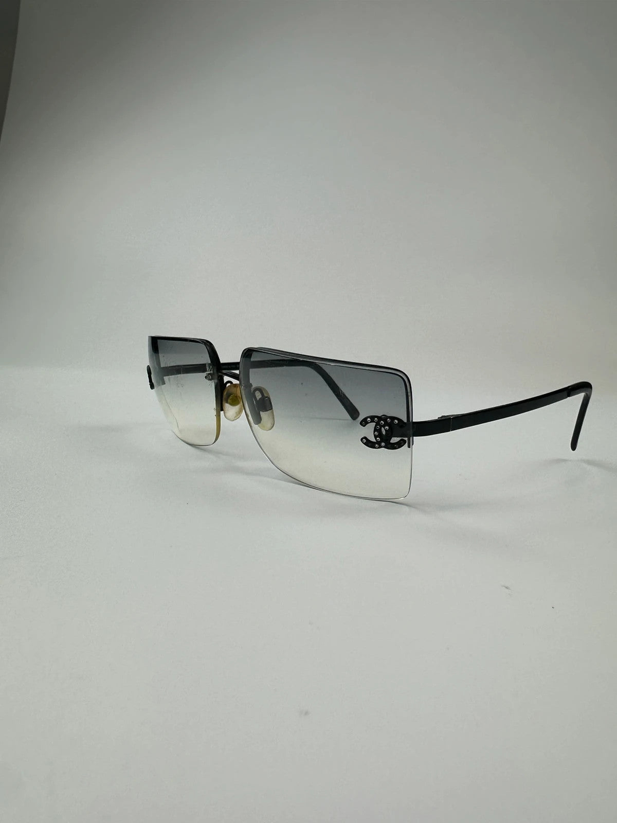 Chanel black and blue rimless sunglasses with double CC logo and strass details.