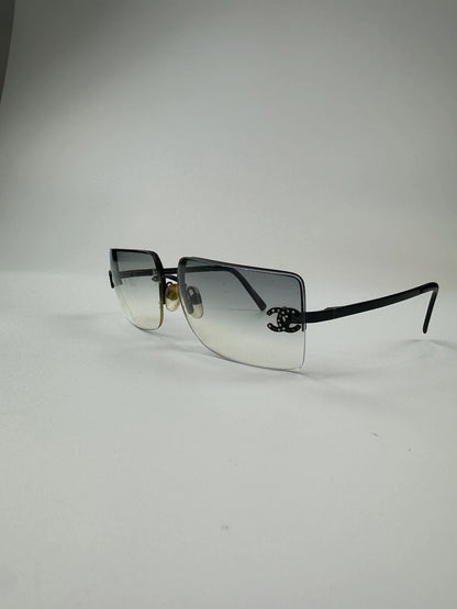 Chanel black and blue rimless sunglasses with double CC logo and strass details.
