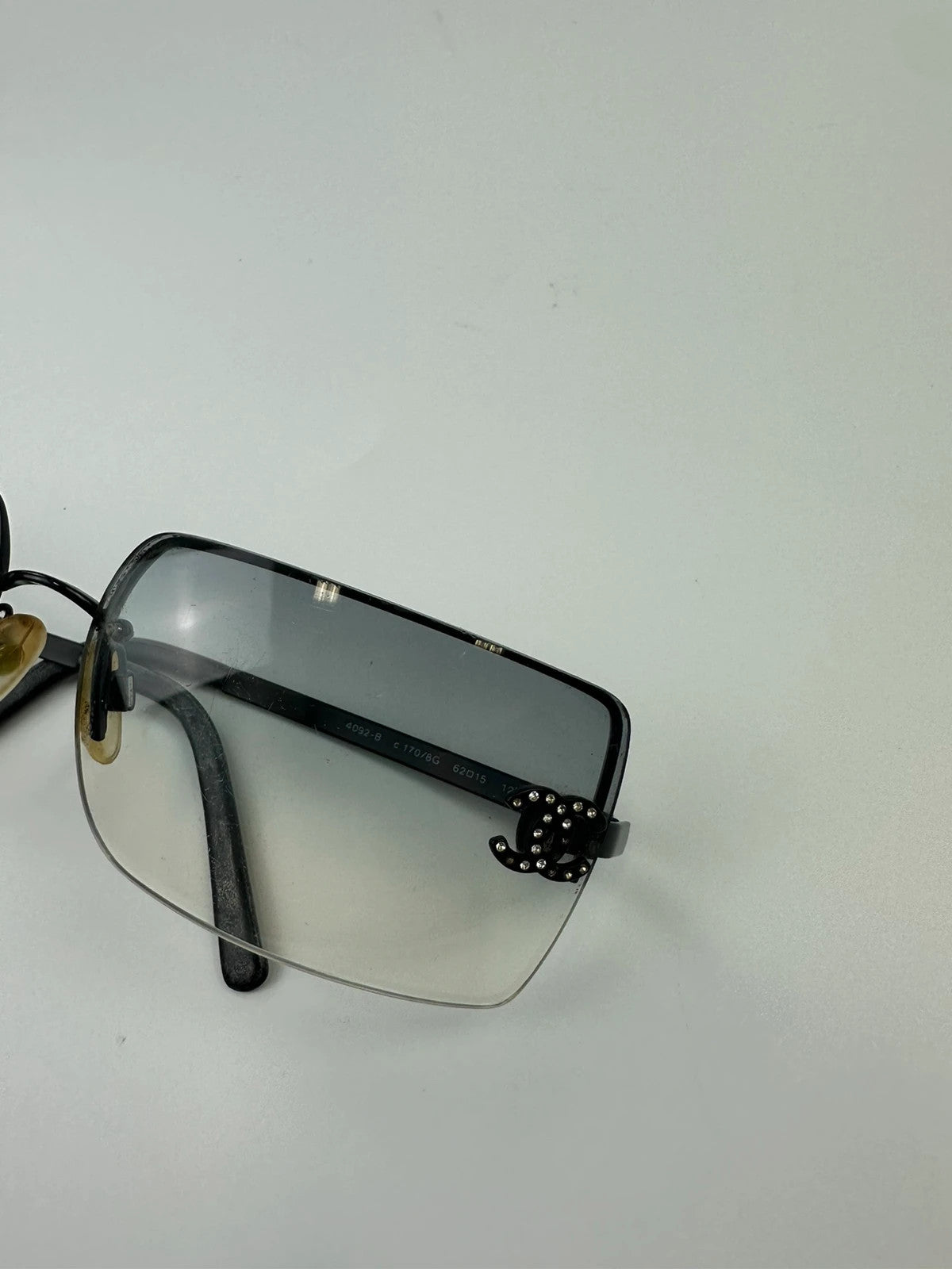 Chanel black and blue rimless sunglasses with double CC logo and strass details.