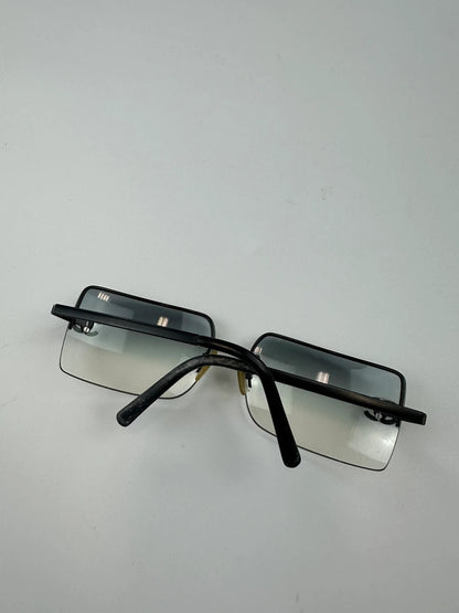 Chanel black and blue rimless sunglasses with double CC logo and strass details.