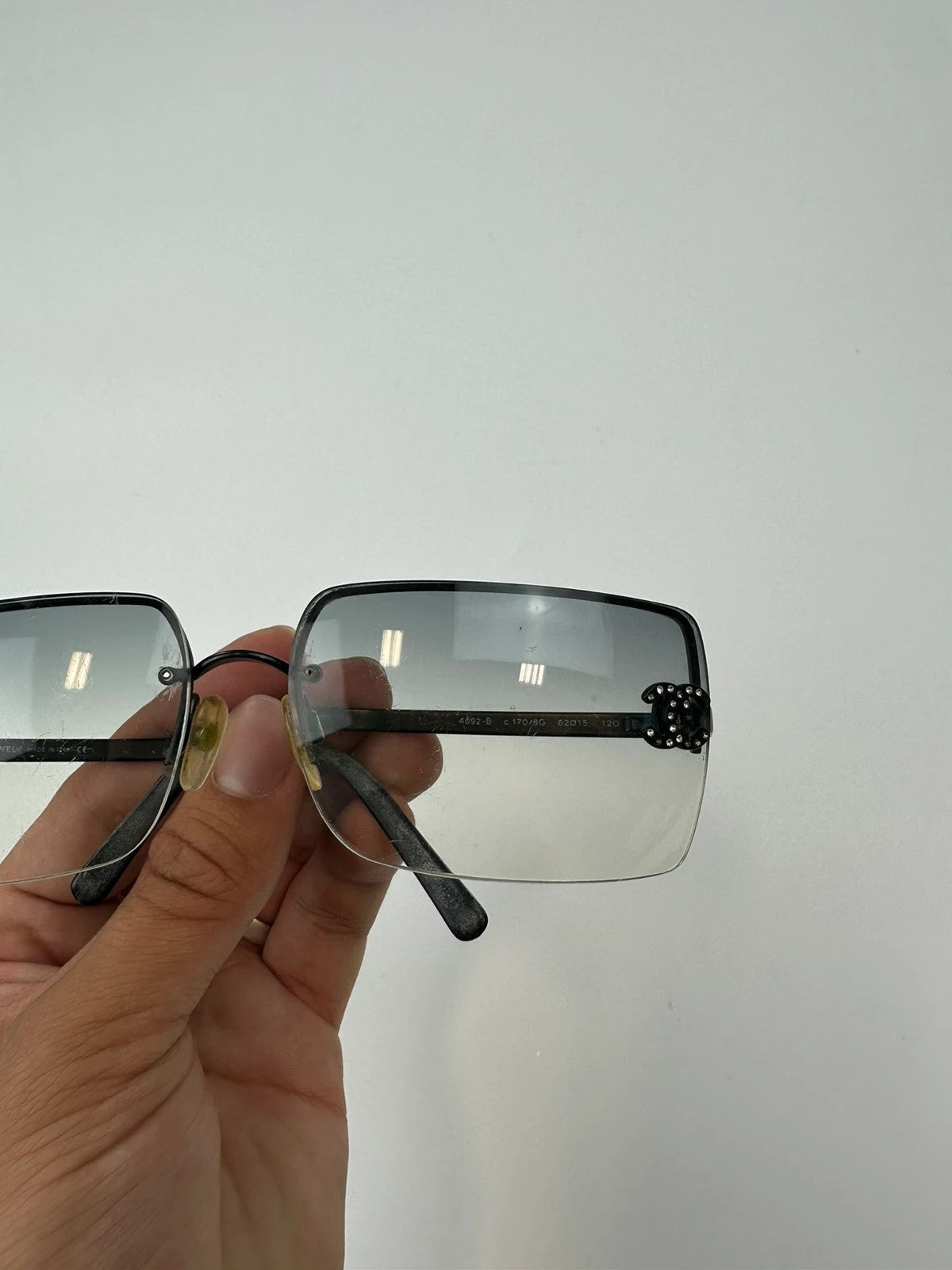 Chanel black and blue rimless sunglasses with double CC logo and strass details.