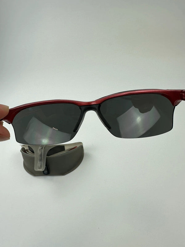 Prada Sport red and black sunglasses with titanium frame and black lenses.