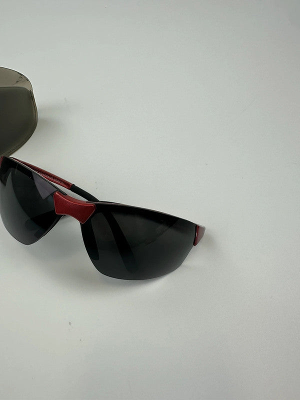 Prada Sport red and black sunglasses with titanium frame and black lenses.