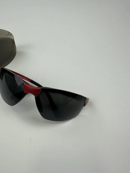 Prada Sport red and black sunglasses with titanium frame and black lenses.