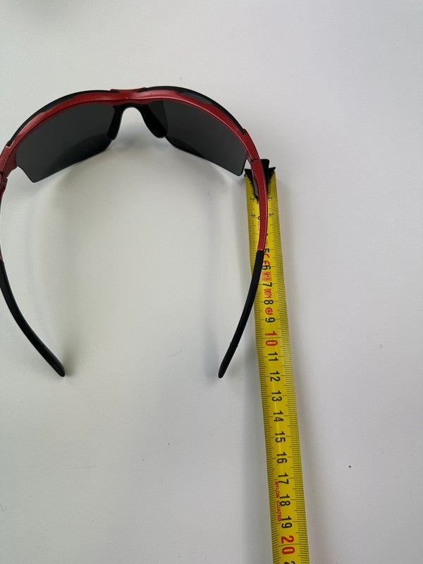 Prada Sport red and black sunglasses with titanium frame and black lenses.