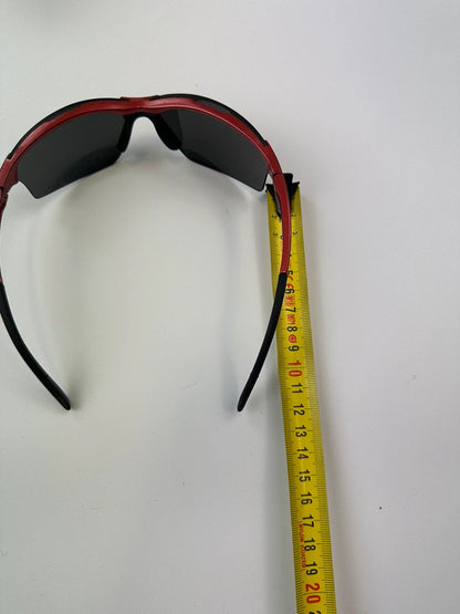 Prada Sport red and black sunglasses with titanium frame and black lenses.