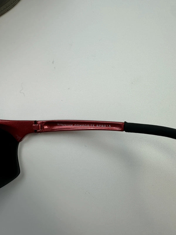 Prada Sport red and black sunglasses with titanium frame and black lenses.