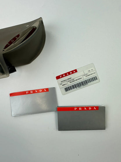 Prada Sport red and black sunglasses with titanium frame and black lenses.