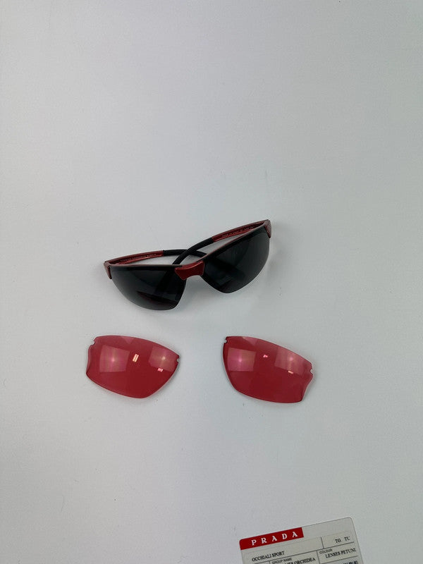 Prada Sport red and black sunglasses with titanium frame and black lenses.