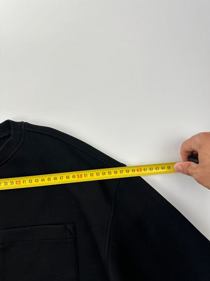 Prada black crop sweater with front pockets and logo detail, boxy fit.