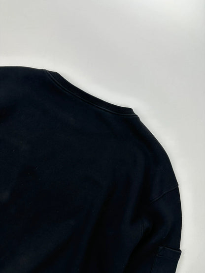 Prada black crop sweater with front pockets and logo detail, boxy fit.
