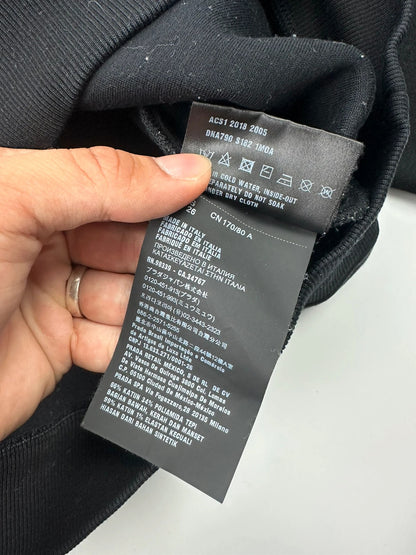 Prada black crop sweater with front pockets and logo detail, boxy fit.