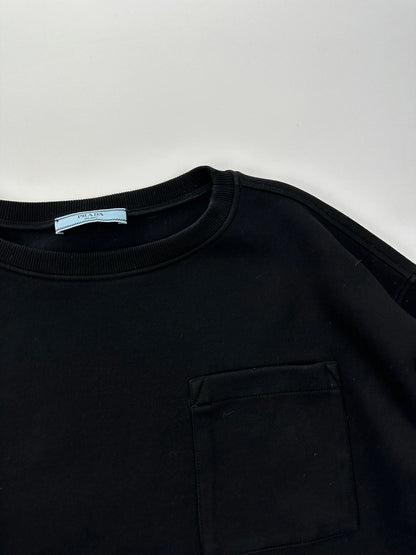 Prada black crop sweater with front pockets and logo detail, boxy fit.