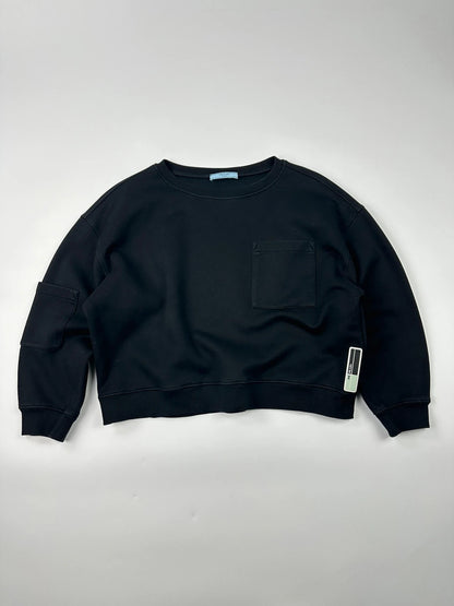 Prada black crop sweater with front pockets and logo detail, boxy fit.
