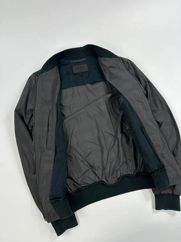 Prada bomber jacket black and grey checkered nylon with logo details.