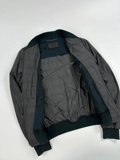 Prada bomber jacket black and grey checkered nylon with logo details.