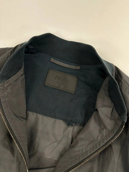 Prada bomber jacket black and grey checkered nylon with logo details.