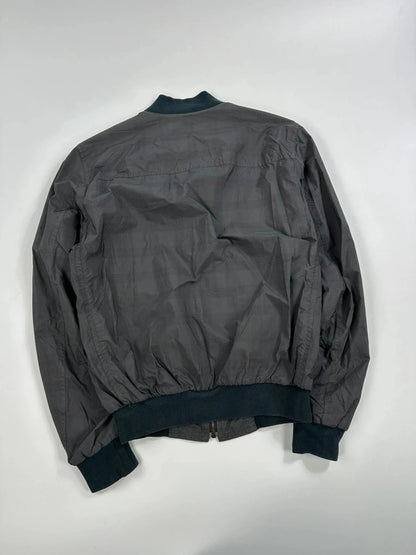 Prada bomber jacket black and grey checkered nylon with logo details.
