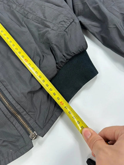 Prada bomber jacket black and grey checkered nylon with logo details.