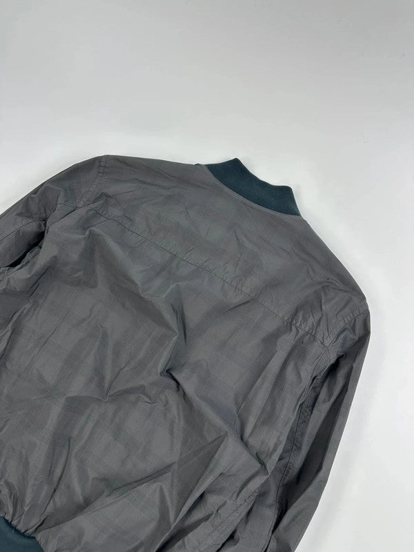 Prada bomber jacket black and grey checkered nylon with logo details.