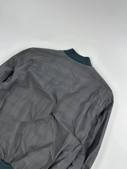 Prada bomber jacket black and grey checkered nylon with logo details.