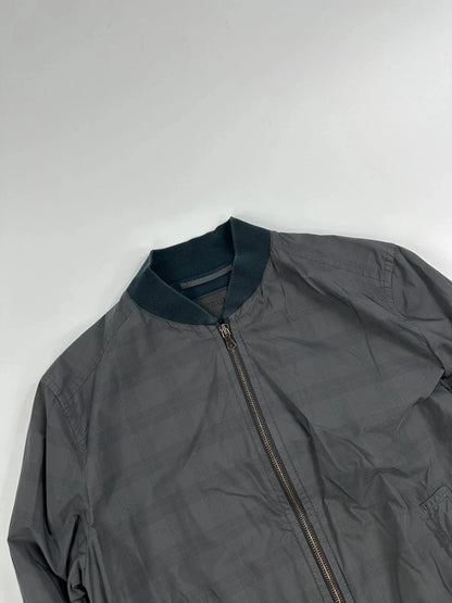Prada bomber jacket black and grey checkered nylon with logo details.
