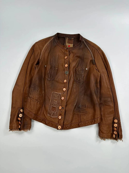 Marithé Francois Girbaud brown leather jacket with orange patches and logo details.