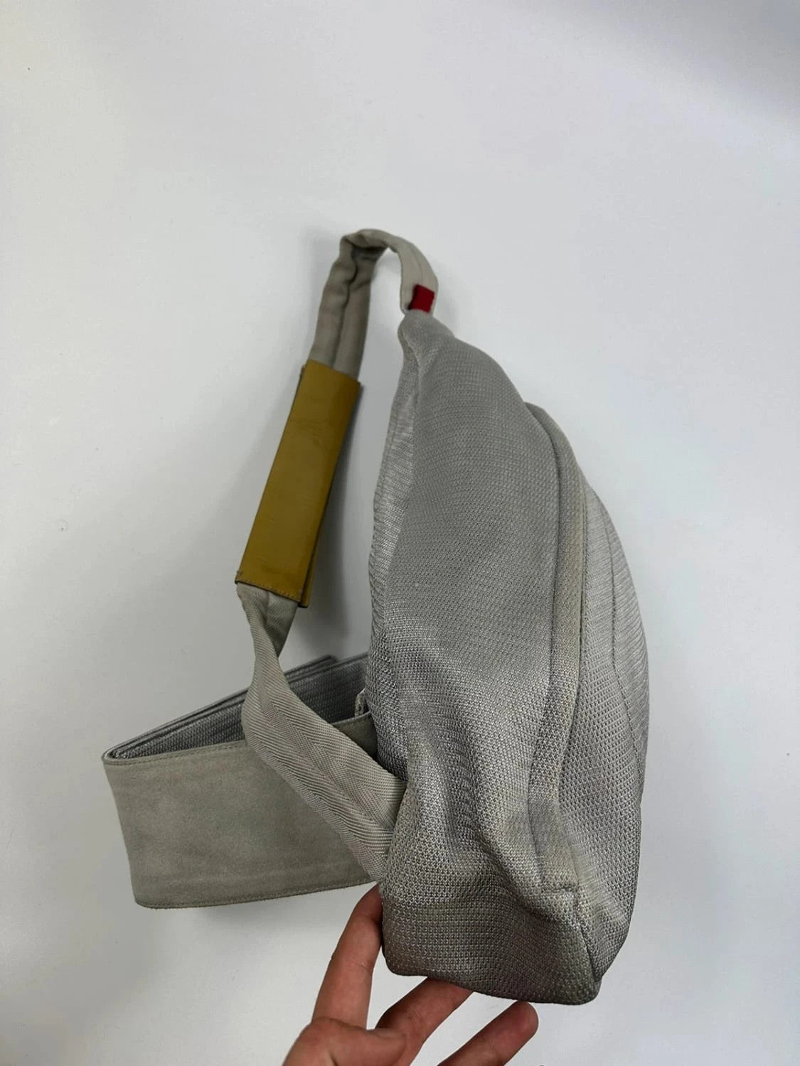 Prada grey sling bag with silver mesh and patent leather, featuring a collector's design.