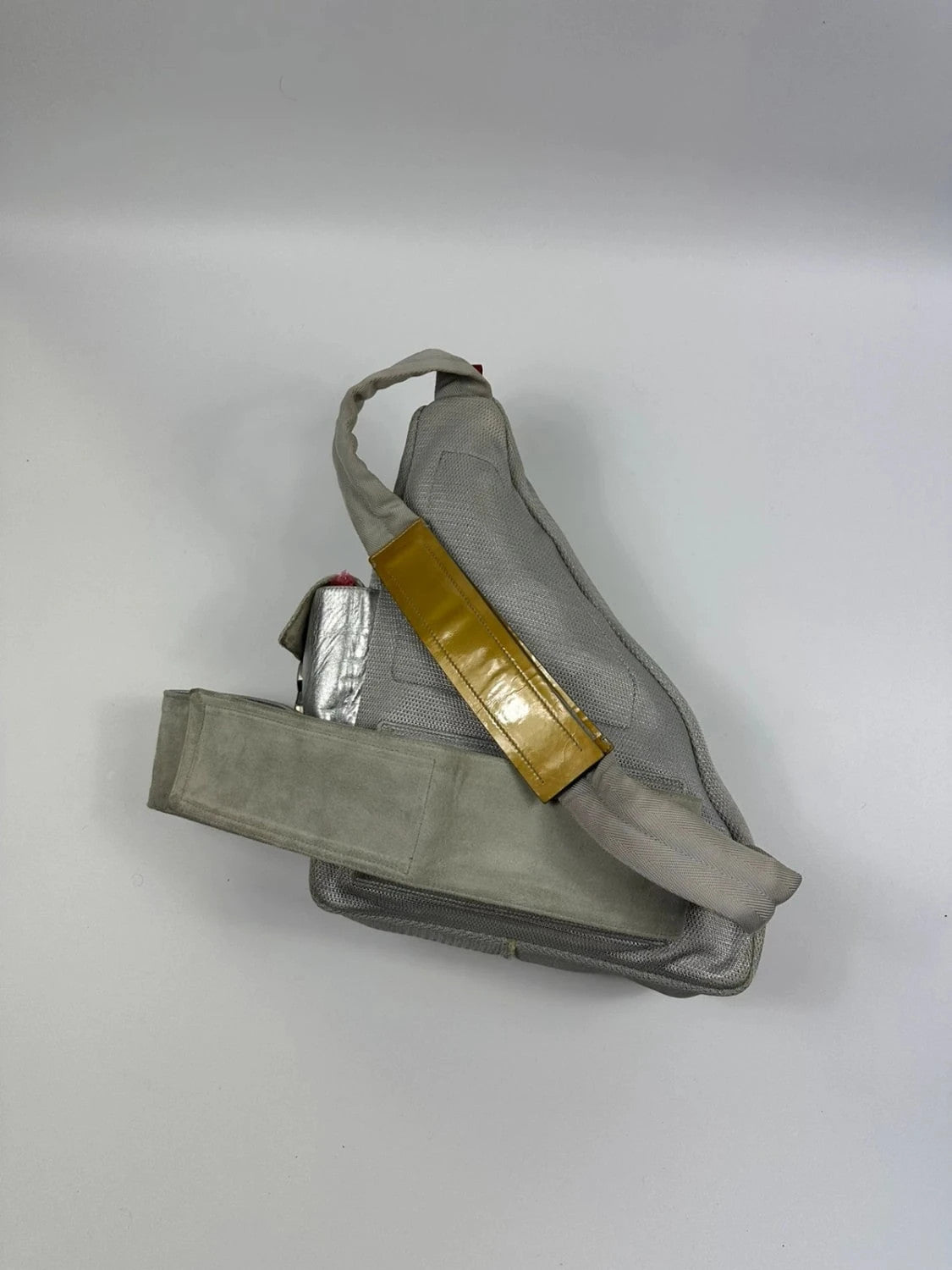 Prada grey sling bag with silver mesh and patent leather, featuring a collector's design.