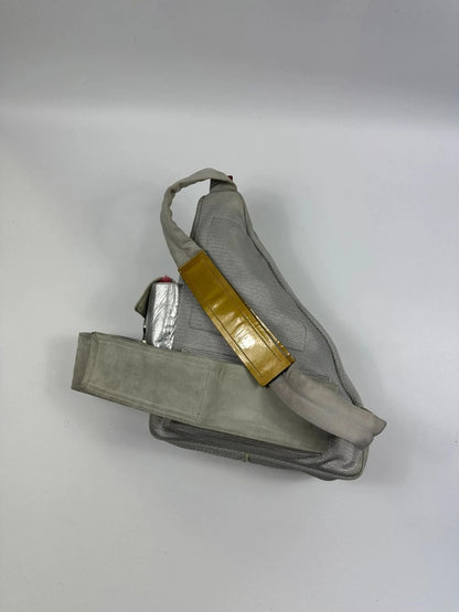 Prada grey sling bag with silver mesh and patent leather, featuring a collector's design.
