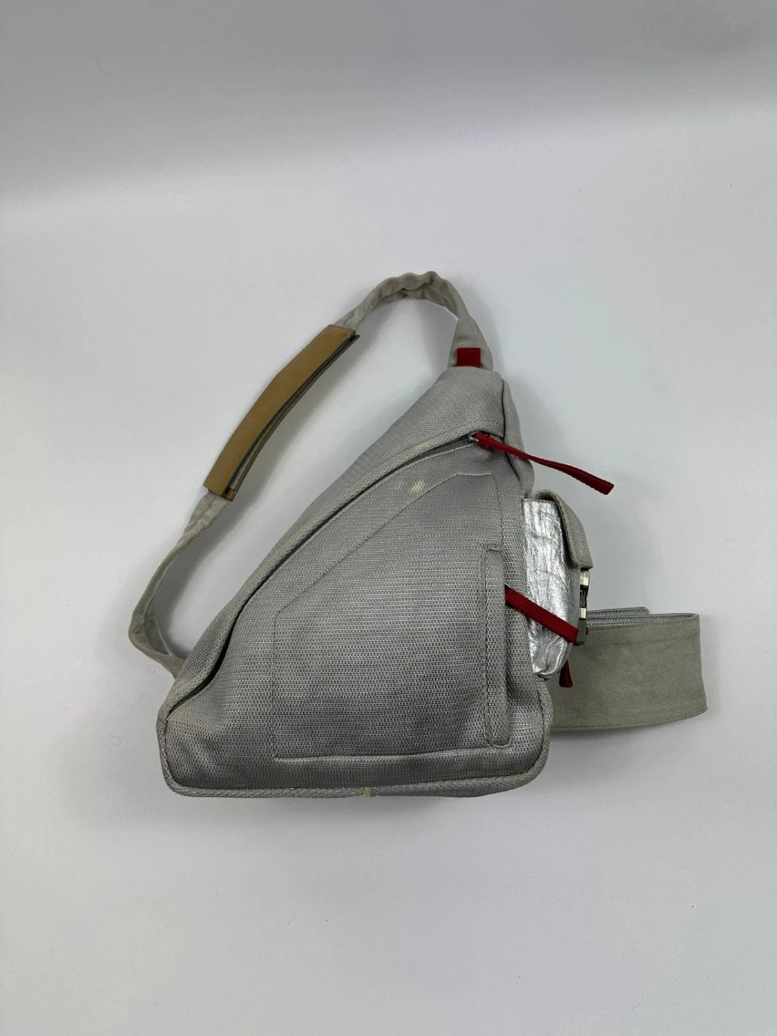 Prada grey sling bag with silver mesh and patent leather, featuring a collector's design.