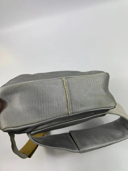 Prada grey sling bag with silver mesh and patent leather, featuring a collector's design.