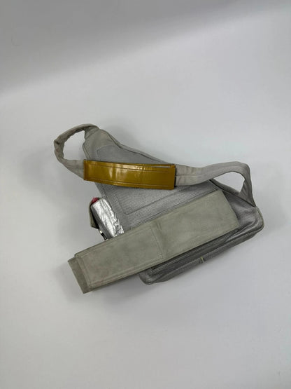 Prada grey sling bag with silver mesh and patent leather, featuring a collector's design.