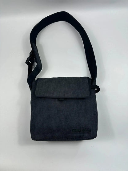 Miu Miu 90s denim crossbody sling bag in black and grey with logo detail.