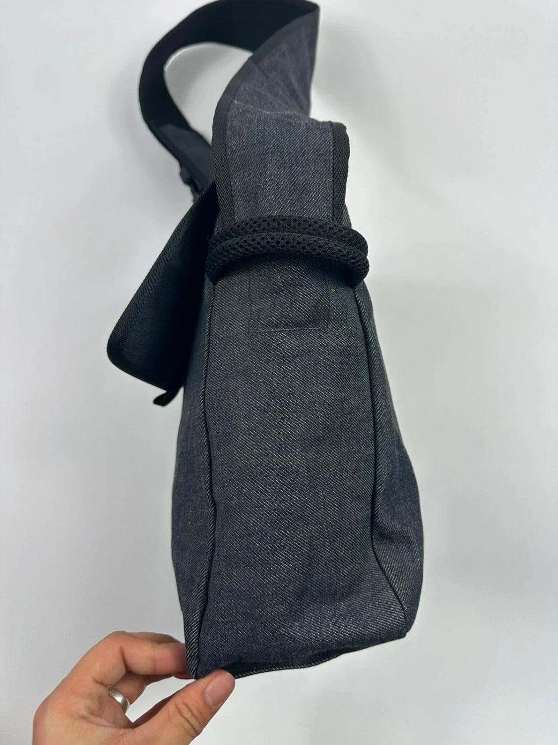 Miu Miu 90s denim crossbody sling bag in black and grey with logo detail.