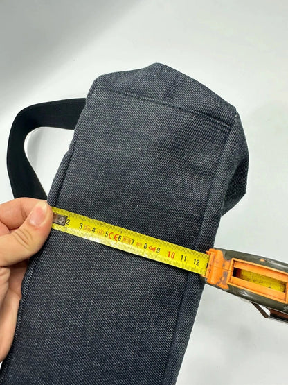 Miu Miu 90s denim crossbody sling bag in black and grey with logo detail.