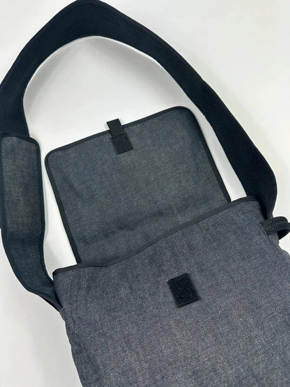 Miu Miu 90s denim crossbody sling bag in black and grey with logo detail.