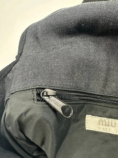 Miu Miu 90s denim crossbody sling bag in black and grey with logo detail.