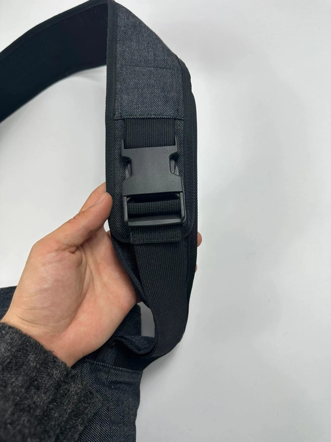 Miu Miu 90s denim crossbody sling bag in black and grey with logo detail.