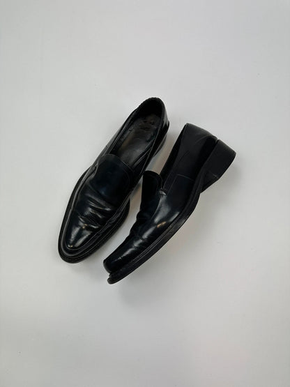 Prada black patent leather loafers with pointy toe and vintage 90's design.